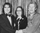 Michou, Serge Lama et Nana Moukouri, à Paris, le 24 décembre 1977. 