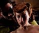 Carla Gugino dans Watchmen, rousse incendiaire