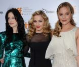 La brune Andrea Riseborough, la star Madonna et la blonde Abbie Cornish à Toronto pour présenter W.E. le 12 septembre 2011.<br />