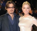 Johnny Depp et Amber Heard pour présenter Rhum Express à Londres, le 3 novembre 2011.