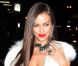 Irina Shayk arrive dans un total look blanc au Crimson pour la soirée Sports Illustrated à New York. Le 14 février 2012.