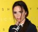 Victoria Beckham, radieuse dans un total look bleu marine signé de son propre label, est de retour à Londres pour lancer sa dernière collection chez Harvey Nichols. Le 17 février 2012.