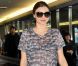 Miranda Kerr souriante à son arrivée à l'aéroport international de Narita. Tokyo, le 7 septembre 2012.