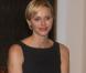 La princesse Charlene de Monaco rencontrant des athlètes des Jeux olympiques spéciaux, à Varsovie, le 17 octobre 2012, dans le cadre de sa visite officielle avec le prince Albert II.
