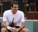 Roger Federer souriant lors d'un entraînement à Roland Garros à Paris le 22 mai 2013