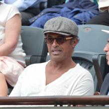 Yannick Noah et Jean Gachassin lors du onzième jour des Internationaux de France à Roland-Garros, le 5 juin 2013