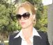 Nicollette Sheridan splendide dans sa tenue chic... a séduit un beau mâle !