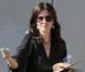 Courteney Cox quitte un studio photo, à Hollywood.