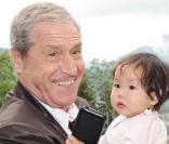 Jean-Claude Darmon et sa filleul lors de la journée de baptême de Joy à Gstaad en Suisse le 5 juillet 2009