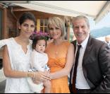Hoda Roche, Joy, Laeticia et Jean-Claude Darmon lors de la journée de baptême de Joy à Gstaad en Suisse le 5 juillet 2009