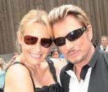 Estelle Lefébure et Johnny Hallyday lors de la journée de baptême de Joy à Gstaad en Suisse le 5 juillet 2009