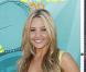 Amanda Bynes, rayonnante dans sa robe jaune  signée Hervé Leger 