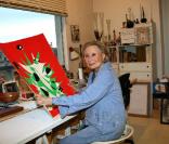 L'élégante Michèle Morgan présente différentes oeuvres de sa collection de peinture. Décembre 2009
