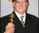 T Bone Burnett, lauréat de la meilleure chanson originale : Crazy Heart, prix qui a été remis par Christina Aguilera et Cher, héroïnes de Burlesque, lors de la 67e cérémonie des Golden Globes à Los Angeles le 17 janvier 2010