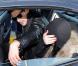 A la sortie d'une défilé de mode, Lindsay Lohan se rend à l'aéroport de Milan et ne peut s'empêcher de s'en prendre aux paparazzi présents en leur jetant une canette de RedBull le 1er mars 2010