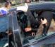 A la sortie d'une défilé de mode, Lindsay Lohan se rend à l'aéroport de Milan et ne peut s'empêcher de s'en prendre aux paparazzi présents en leur jetant une canette de RedBull le 1er mars 2010