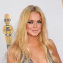 Lindsay Lohan : Même en shooting sexy, elle ne quitte plus ses bottes !