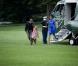Barack et Michelle Obama arrivent avec leur fille cadette Sasha à Washington le 15 août après un séjour d'une journée à Panama City