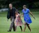 Barack et Michelle Obama arrivent avec leur fille cadette Sasha à Washington le 15 août après un séjour d'une journée à Panama City
