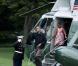 Barack et Michelle Obama arrivent avec leur fille cadette Sasha à Washington le 15 août après un séjour d'une journée à Panama City