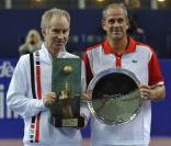 John McEnroe et Guy Forget à l'occasion du tournoi Jean-Luc Lagardère, au stade Pierre de Coubertin, à Paris, le 3 cotobre 2010.