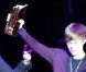 Justin Bieber reçoit le NRJ Music Award de la Révélation internationale de l'année des mains de Nikos Aliagas, lors de sa venue au Grand Rex (Paris), le jeudi 17 février.