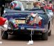 Le prince William et Catherine, duc et duchesse de Cambridge, se sont éclipsés du vin d'honneur à Buckingham Palace, le 29 avril 2011, au volant de la DB6 Volante Aston Martin du prince Charles. Direction Clarence House, pour se changer en vue du dîner et de la soirée dansante !