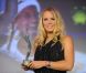  Arrivée avec le prince Frederik de Danemark comme cavalier, la Danoise Caroline Wozniacki, numéro un mondial de tennis, était divine pour recevoir son trophée lors du dîner annuel de l'ITF pour ses World Champions, au Pavillon d'Armenonville, le 31 mai 2011. 