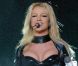 Britney Spears entame le sensuel  Onyx Hotel Tour  en 2004. 