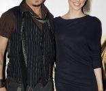 Johnny Depp et Amber Heard présentent Rhum Express, à Paris, le 8 novembre 2011.