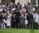 Jean-Marie Bigard et sa femme Lola Marois entourés de leurs familles, lors de leur mariage à la mairie du VIIe arrondissement   de Paris, le 27 mai 2011, par Rachida Dati.