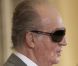 Le roi Juan Carlos et ses lunettes de soleil lors de la remise des médailles d'or des Beaux-Arts au ministère de la Culture, à Madrid, le 24 novembre 2011