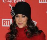 Karine Lima lors d'une soirée au profit de l'association Petits  Princes et de  lancement du train rouge Coca Cola, le 15 décembre 2011, à  Paris