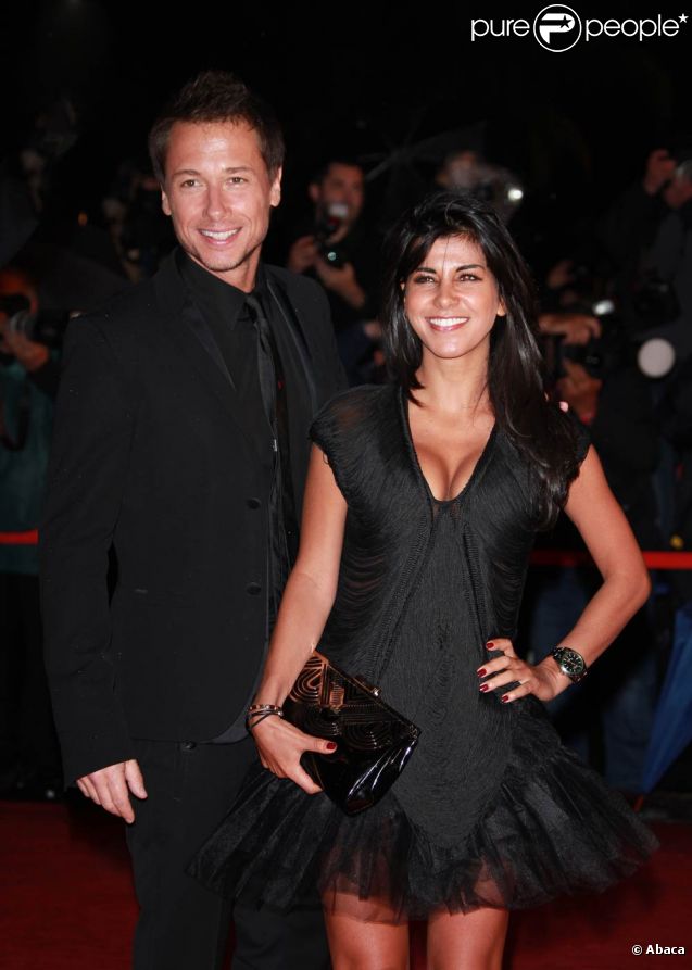 Stéphane Rousseau et sa compagne Reem Kherici sur le tapis rouge de la 13e édition des NRJ Music Awards, au palais des festivals de Cannes, le 28 janvier 2012.