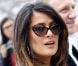 Salma Hayek, accompagnée de son mari François-Henri Pinault, signe une arrivée digne d'une star hollywoodienne lors du défilé Balenciaga à Paris, le 1er mars 2012.