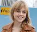 Clémence Poésy, souriante, assistait au défilé Balenciaga à Paris, le 1er mars 2012.