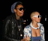Amber Rose et son fiancé Wiz Khalifa sortent d'un concert des Guns N' Roses à Los Angeles le 12 mars 2012