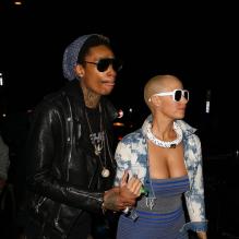 Amber Rose et son fiancé Wiz Khalifa sortent d'un concert des Guns N' Roses à Los Angeles le 12 mars 2012