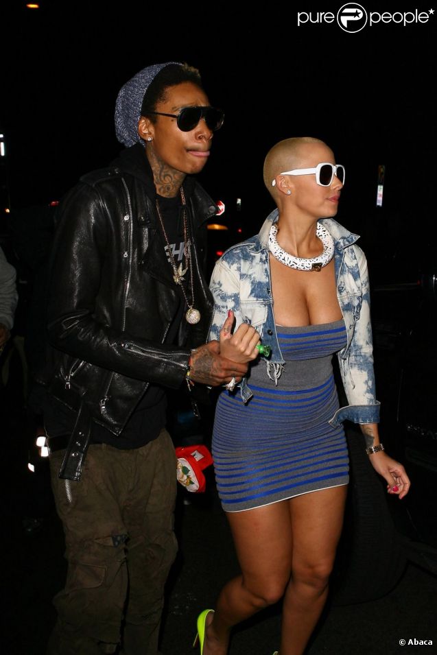 Amber Rose et son fiancé Wiz Khalifa sortent d'un concert des Guns N' Roses à Los Angeles le 12 mars 2012