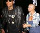 Amber Rose et son fiancé Wiz Khalifa sortent d'un concert des Guns N' Roses à Los Angeles le 12 mars 2012