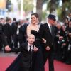 Le réalisateur Jacques Audiard, Marion Cotillard avec le petit Armand Verdure lors de la présentation du film De rouille et d'os au festival de Cannes le 17 mai 2012