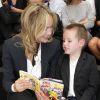 Sharon Stone et son fils Quinn au défilé Dior Homme Printemps-Eté 2013 au Tennis Club de Paris, le 30 juin 2012.