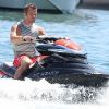 Sébastien Loeb et sa femme Séverine en vacances dans le port de Saint-Tropez le 23 juillet 2012