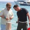 Elton John et son mari David Furnish arrivent au Club 55 de Saint-Tropez avec quelques amis le 13 août 2012