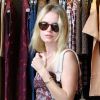 Kate Bosworth, fan de son sac Alexander Wang qu'elle porte avec une robe Etoile Isabel Marant et des bottines Isabel Marant.