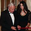 Monica Bellucci, accompagnée de Bernard Fornas, président de Cartier International, bénit la boutique Cartier rénovée. Milan, le 4 octobre 2012.