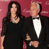 Monica Bellucci, au bras du président de Cartier International Bernard Fornas, célèbre la réouverture de la boutique Cartier après neuf mois de travaux. Milan, le 4 octobre 2012.
