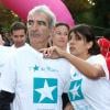 Raymond Domenech et Estelle Denis lors de la 10e édition de de la course Odyssea au profit de de la lutte contre le cancer du sein au château de Vincennes le 7 Octobre 2012