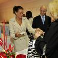 La princesse Stéphanie de Monaco remettait des colis alimentaires à des personnes âgées le 18 novembre 2012, dans le cadre de la Fête nationale, dans le Salon Rainier III du palais princier.