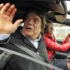 Bernard Tapie repond aux journalistes alors qu'il quitte le siege de Nice-Matin, dont il vient de prendre la direction. Depuis hier, l'homme d'affaires est a la tete des quotidiens "Nice-Matin" et "La Provence". Nice, le 20 decembre 2012  French businessman Bernard Tapie answers to journalists as he leaves in a car the headquarters of French daily paper "Nice-Matin" in Nice, Southern France, after a visit on 20 December, 2012. Tapie took yesterday control of La Provence daily paper, based in Marseille, and Nice-Matin, both owned by French Groupe Hersant Medias (GHM). GHM is headed by French Philippe Hersant, son of late media tycoon Robert Hersant.20/12/2012 - NICE